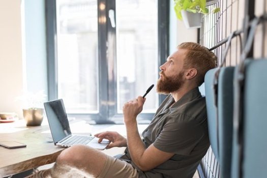 side-view-man-thinking-while-working